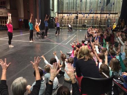 people meet with the approval of a large audience as they dance on a large stage