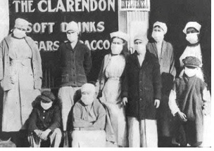 black and white group photo taken during spanish influenza outbreak in 1918, everybody's wearing a mask